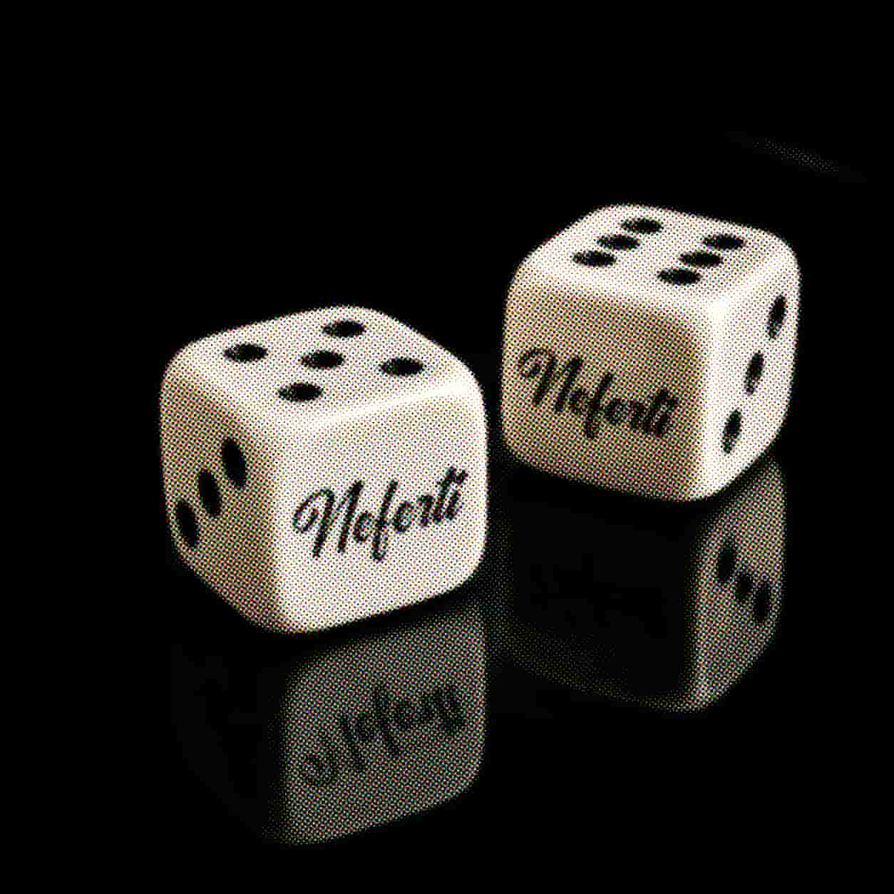 Neferti branded dice on a black reflective surface